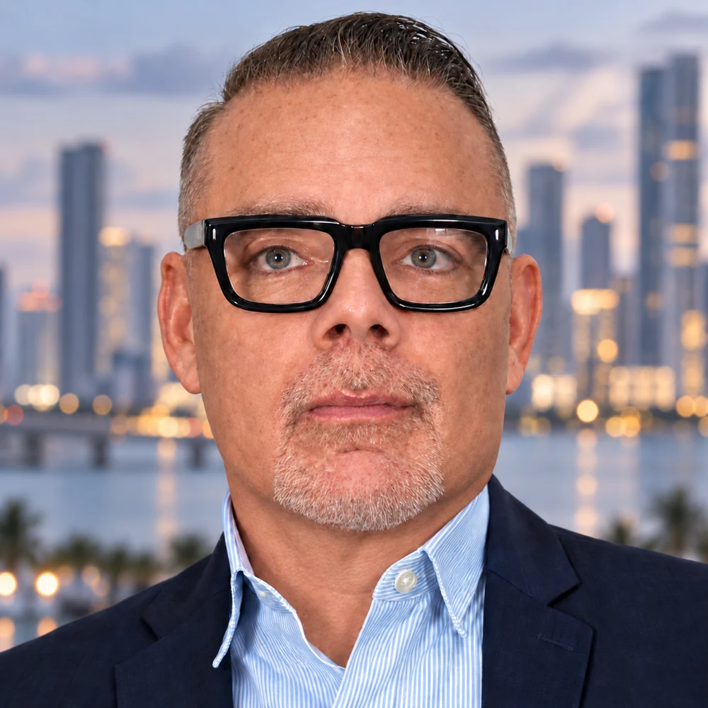 Seth Mossberg with a subdued Miami skyline backdrop